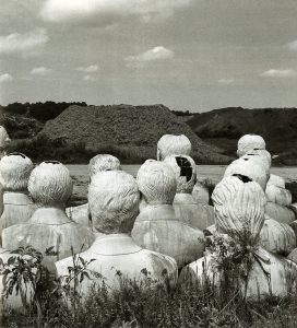 Crumbling concrete statues of the presidents of the United States.