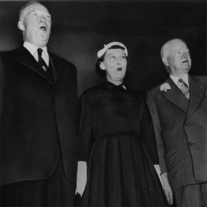 President Dwight Eisenhower, First Lady Mamie and former president Herbert Hoover, singing at the Republican Lincoln Dinner - 02/05/1954.